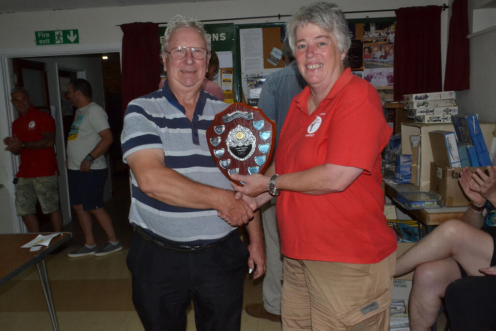 Dace recieving the trophy from Harriet