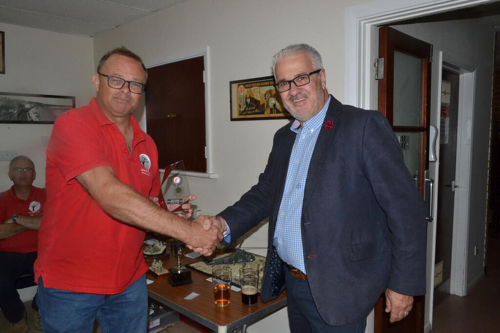 Paul McHugh receiving the Members Trophy from Tony Bainbridge
