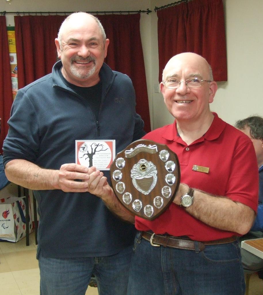 Eric awarding the trophy to Mark