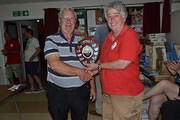 Dace recieving the trophy from Harriet