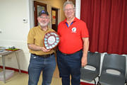 David receiving the trophy from Eric